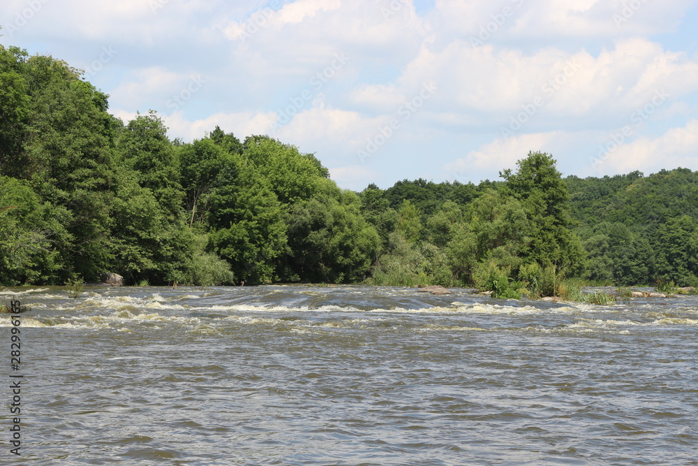 Small rapids on flat rivers attract tourists and travelers in the summer