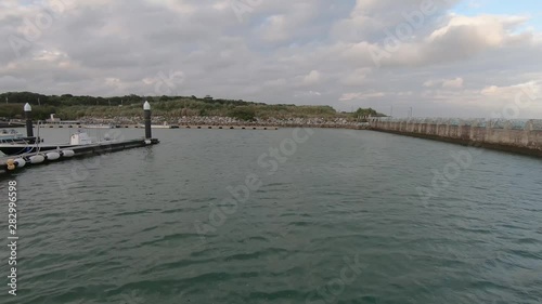 Wallpaper Mural POV Time Lapse from front of boat cruising into small town port. Kumejima, Okinawa, Japan. Torontodigital.ca