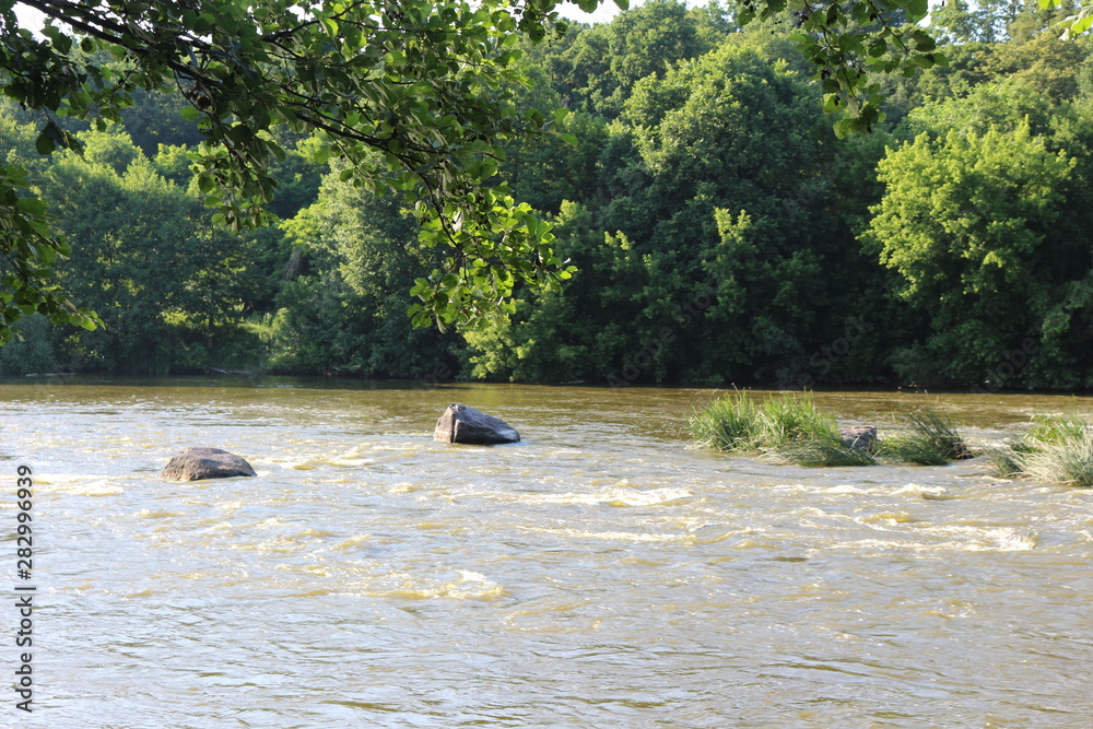 Small rapids on flat rivers attract tourists and travelers in the summer