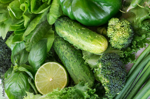 Healthy green vegetables: broccoli, lettuce, onions and lime