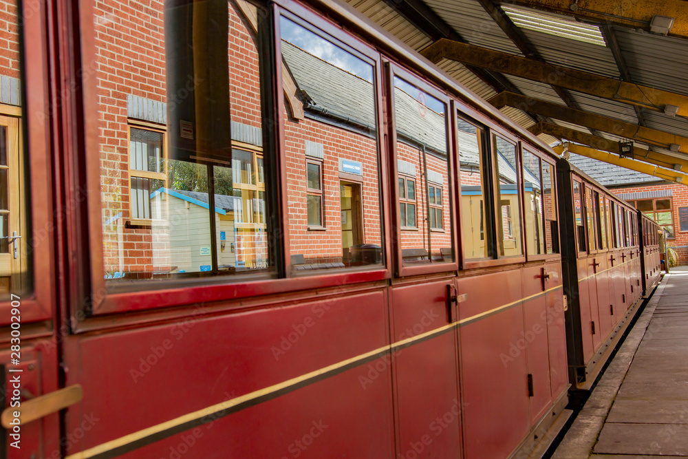 Train carriages parked up against the platform at Aylsham railway station waiting for the passengers to board for the return journey to Wroxham and Hoveton