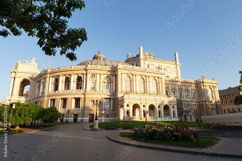 Ukraine  Odessa  13th of June 2019. Side view of the national academic opera building and the park with beautiful flower beds during a sunny day