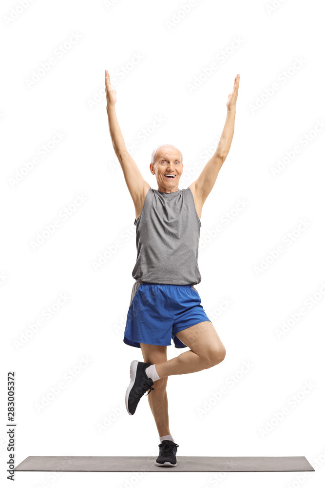 Elderly man exercising and stretching a leg
