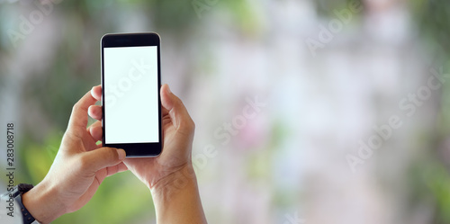 Close-up view of man holding blank screen smartphone