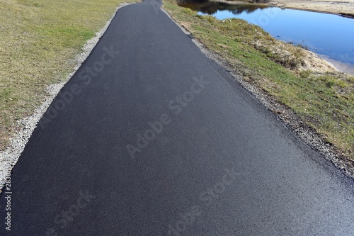 Newly laid bitumen path photo