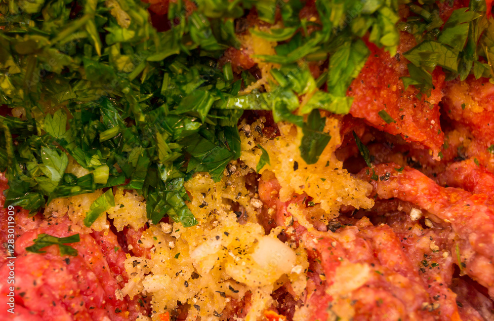 minced beef meat with herbs close-up minced beef meat with herbs close-up