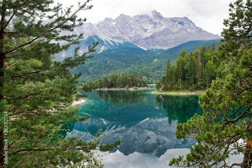 Eibsee lake in front of Zugspitze mountain in Bavaria Germany. Gorgeous view. Alpine landscape with German Alps mountain Zugspitze 