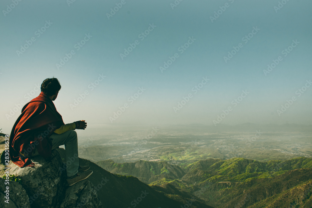Silhouette of a man on top of mountain Silhouette of a man on top of mountain