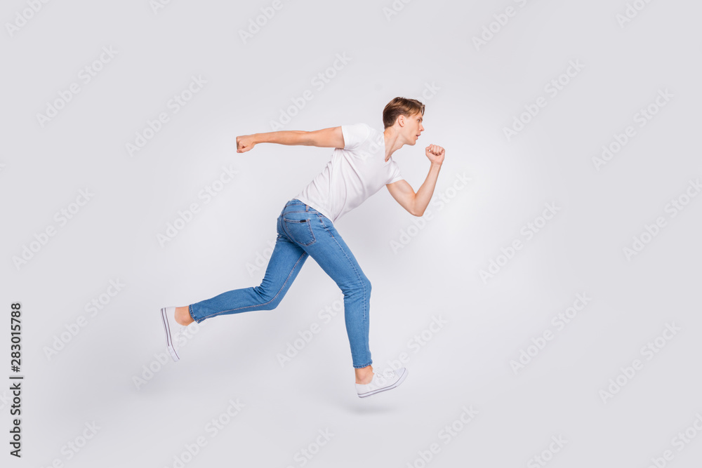 Full length photo of jumping high guy ready to begin race wear casual outfit isolated white background