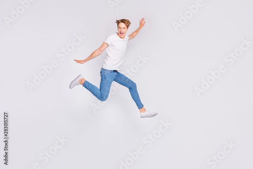 Full body profile photo of jumping high guy feel himself lightweight wear casual outfit isolated white background