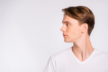 Profile photo of macho guy looking empty space wear casual t-shirt isolated on white background