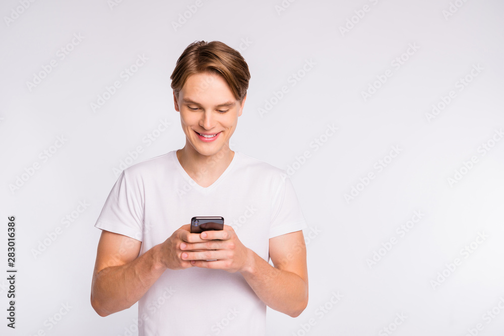Photo of amazing guy searching website in new telephone wear casual outfit isolated on white background Photo of amazing guy searching website in new telephone wear casual outfit isolated on white background