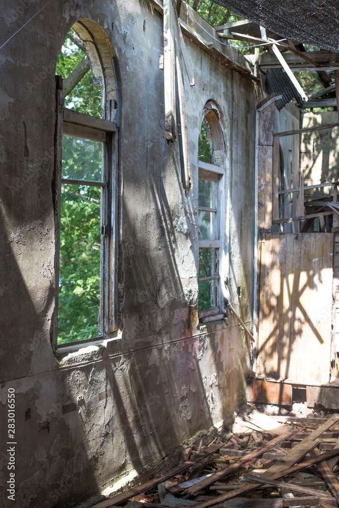 Inside the old abandoned church. sunny day window