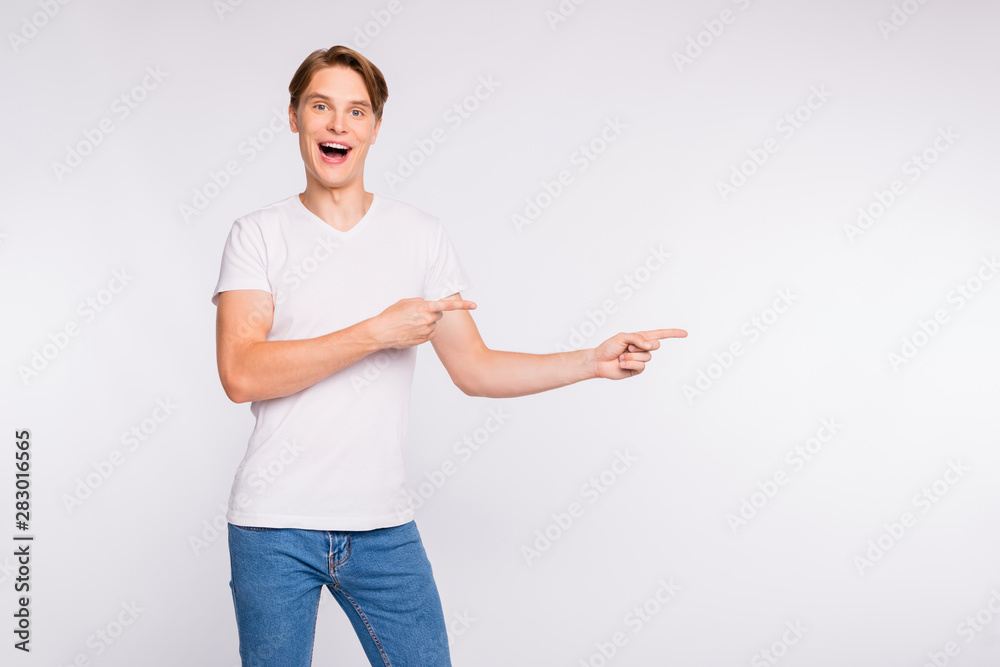 Cool guy indicating fingers side empty space on cool prices wear casual outfit isolated white background Cool guy indicating fingers side empty space on cool prices wear casual outfit isolated white background