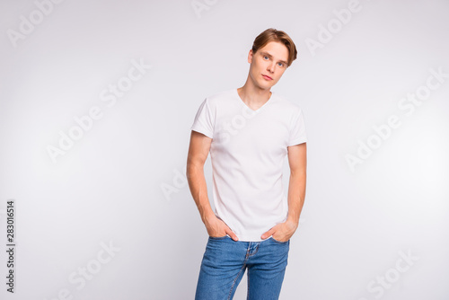 Photo of amazing guy hold hands pockets wear casual outfit isolated on white background