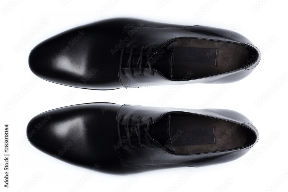 Classic male leather shoes isolated on a white, top view.