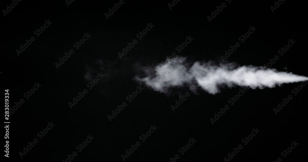 Fototapeta White smoke trail isolated on black background.