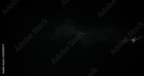 White smoke trail isolated on black background.