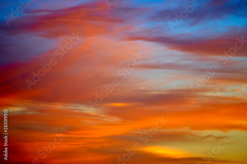 Incredibly colorful sunset on the tropical beach. Abstract nature background.