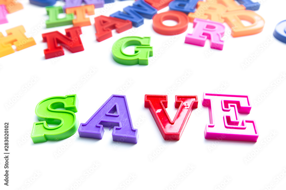 Heap of plastic colored alphabet letters close up. Save Heap of plastic colored alphabet letters close up. Save
