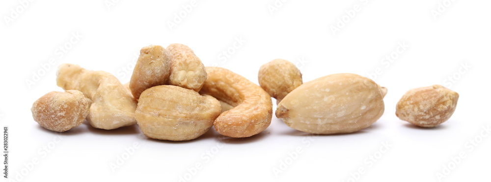 Mix of roasted, salted peanuts, cashew nuts and almonds isolated on white background Mix of roasted, salted peanuts, cashew nuts and almonds isolated on white background