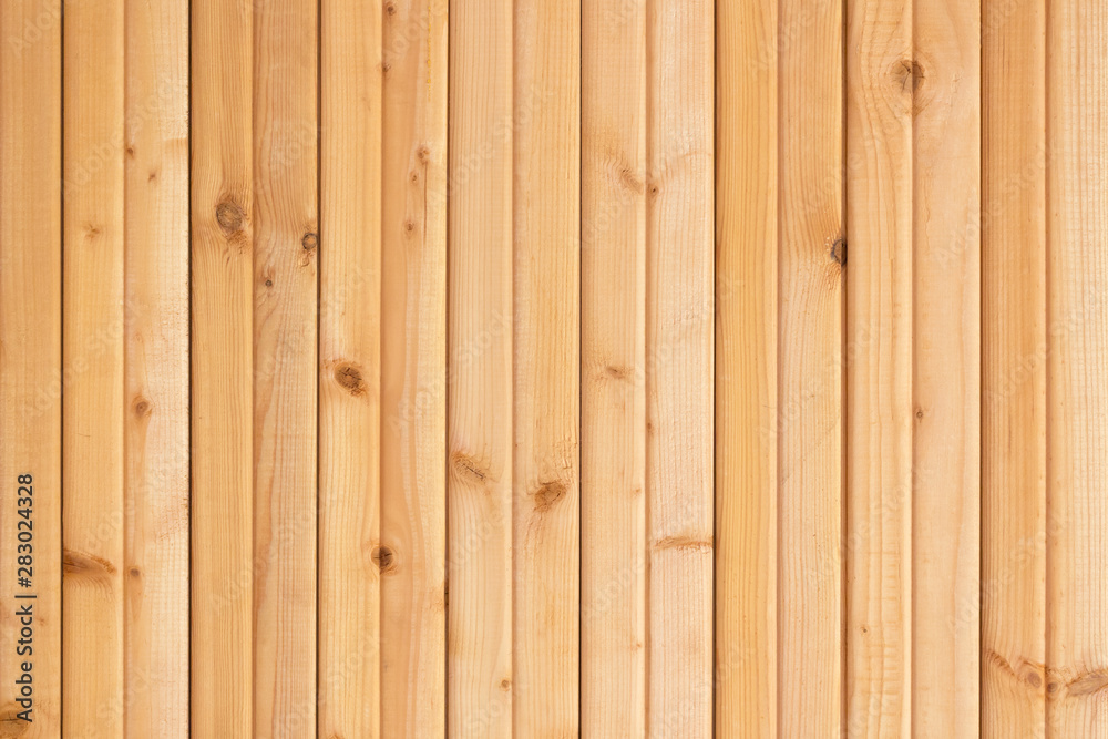 Light brown wooden planks wall texture background. Architecture detail abstract texture. Light brown wooden planks wall texture background. Architecture detail abstract texture.