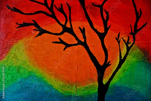 Fototapeta Naklejka Na Ścianę i Meble -  in a oil pastel painting a black tree standing with colorful background