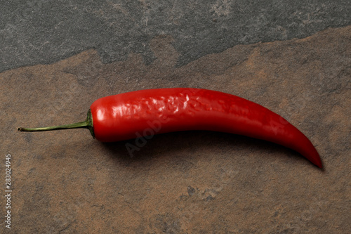 top view of Mexican spicy colorful peppers on stone table