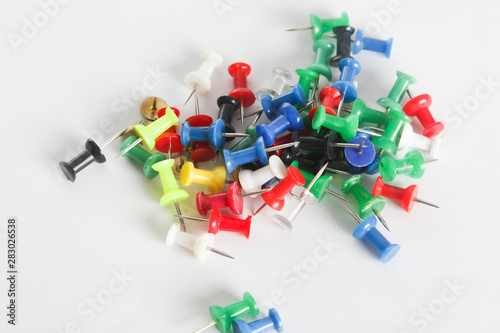 Colorful thumb tack on the white background