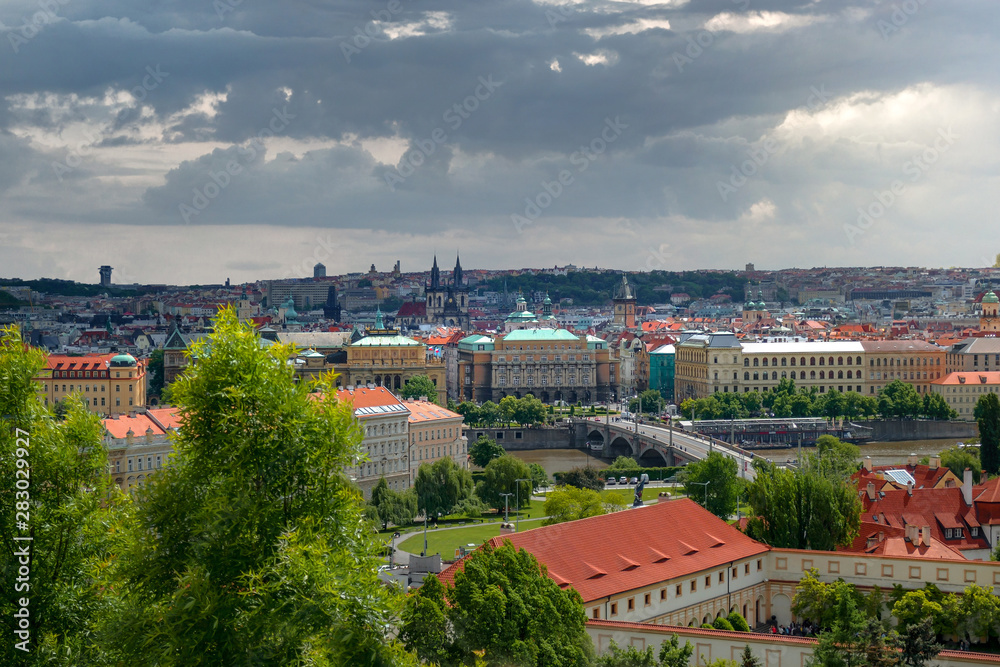 Scenic panoramic view of historical center of Prague,bridges and Vlatva river on a cloudy day