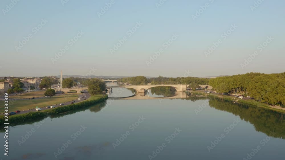 Aerial view in Avignon France during the sunrise with a traffic and the Avignon Bridge, Pont d'Avignon or Pont St-Bénézet Aerial view in Avignon France during the sunrise with a traffic and the Avignon Bridge, Pont d'Avignon or Pont St-Bénézet