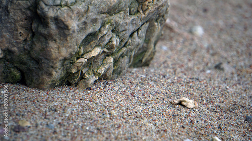 Big rock and small pebble