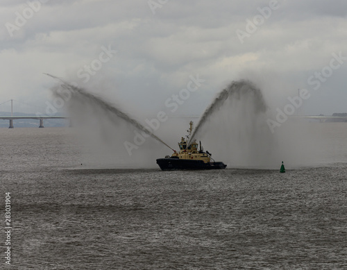 Tug boat tests its fire hoses