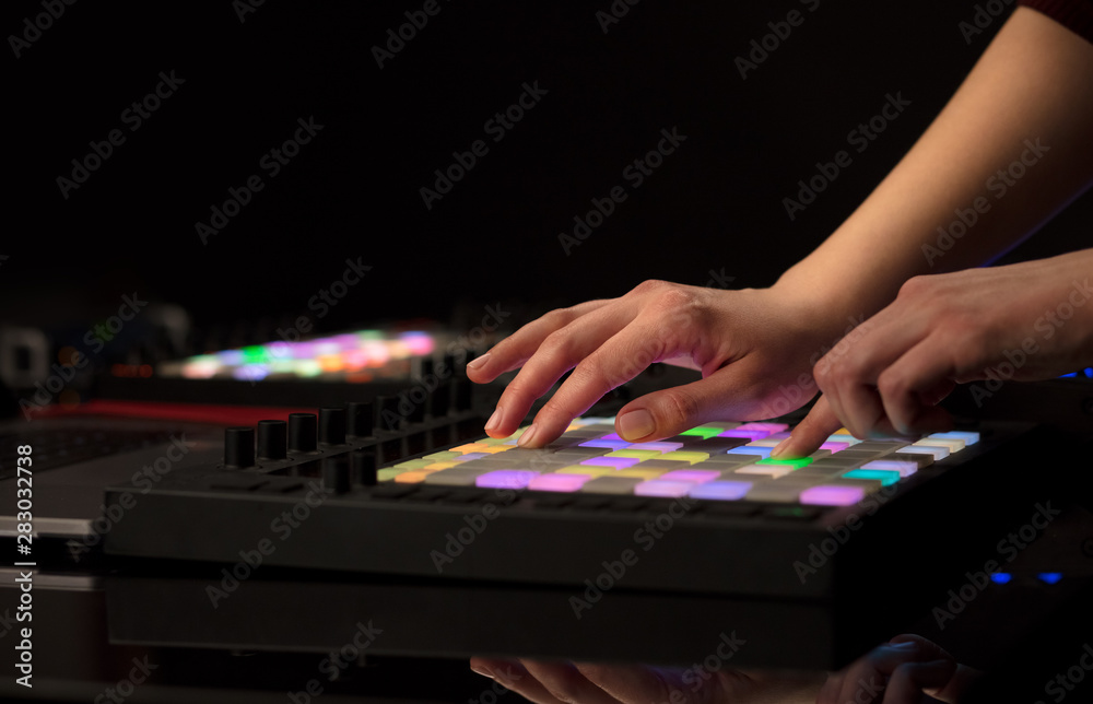 Fototapeta premium Dj hand remixing music on midi controller