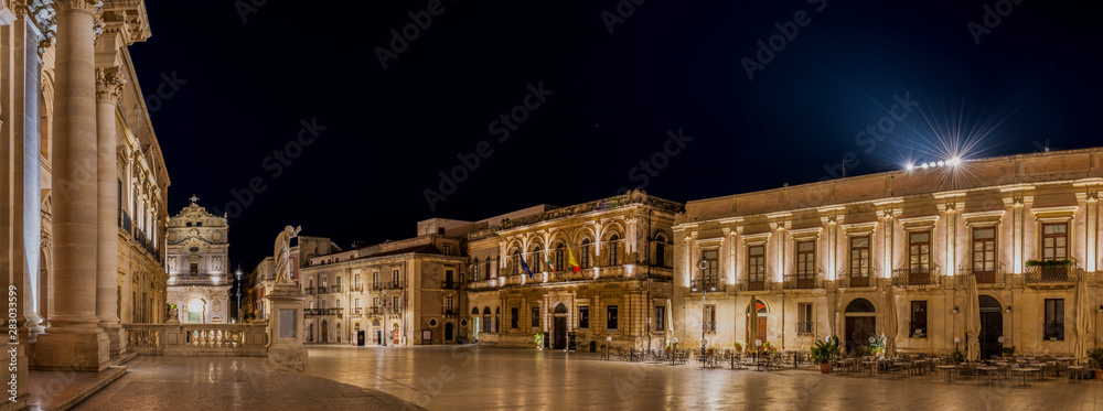 Panorama of the main square of the ancient sicilian baroque town, island of Ortigia near Siracusa city in Sicily, south Italy