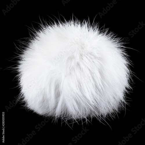 White pompom isolated on black