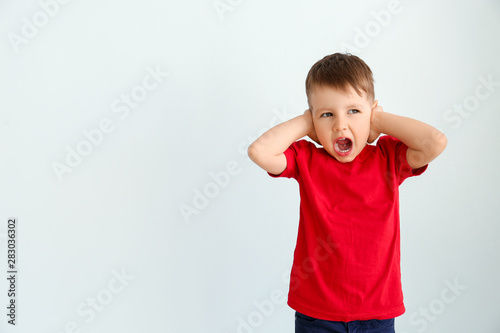 Screaming little boy with a...