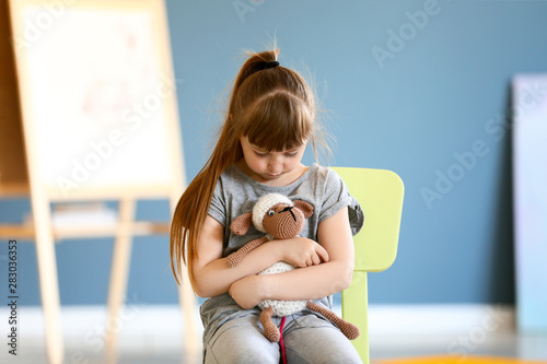 Sad little girl with autist...