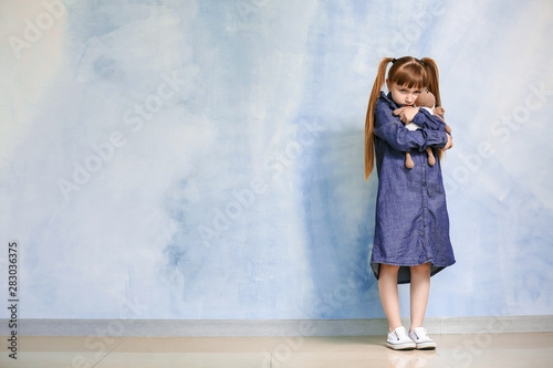 Sad little girl with autist...