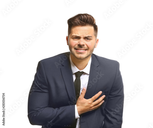 Young businessman suffering...