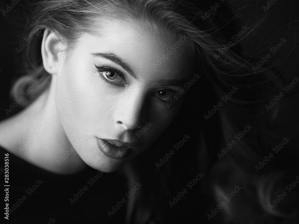 Fototapeta premium Black and white portrait of a girl made in studio