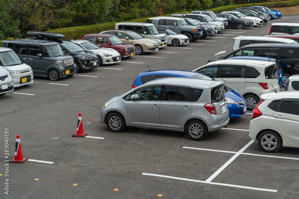 Fototapeta premium row of cars parked in outdoor parking