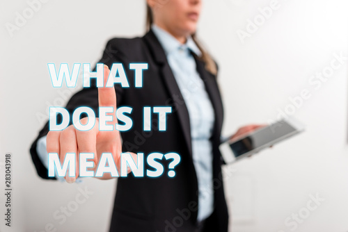 Conceptual hand writing showing What Does It Means question. Concept meaning asking someone about meaning something said and you do not understand Digital business in black suite concept with business