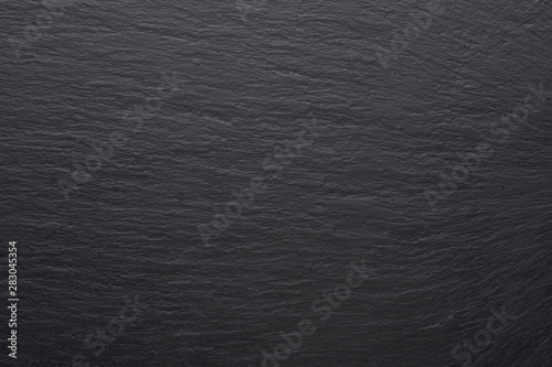 Black stone tile texture. Empty black surface with copy space