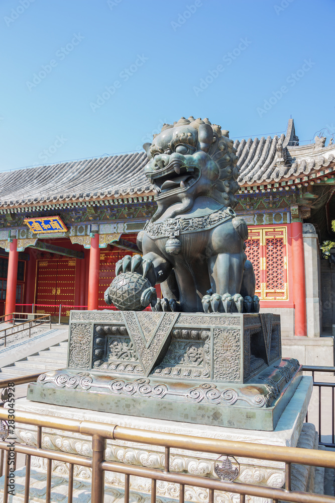 Fototapeta premium Bronze lion guarding the Summer Palace, the former imperial garden