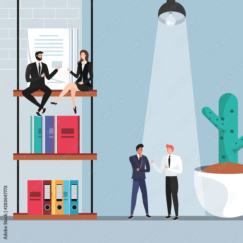 mini business people with books in the workplace mini business people with books in the workplace