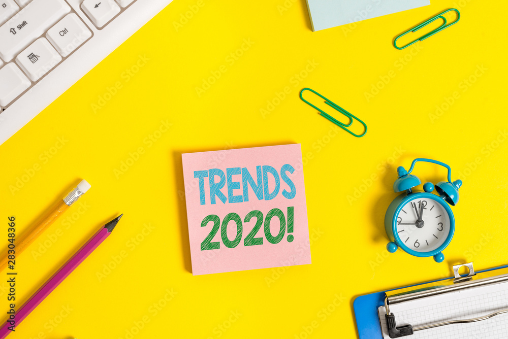 Text sign showing Trends 2020. Business photo showcasing general direction in which something is developing or changing Flat lay above copy space on the white crumpled paper