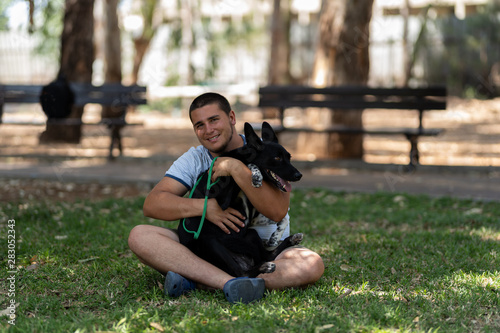 young man with a dog in the park