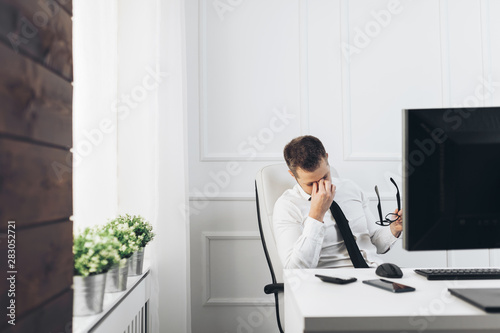 Tired businessman from heavy workload photo