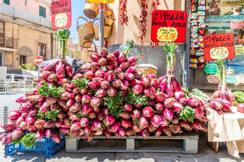 Red onion sold on Tropea's streets as specialty of the region, Italy photo